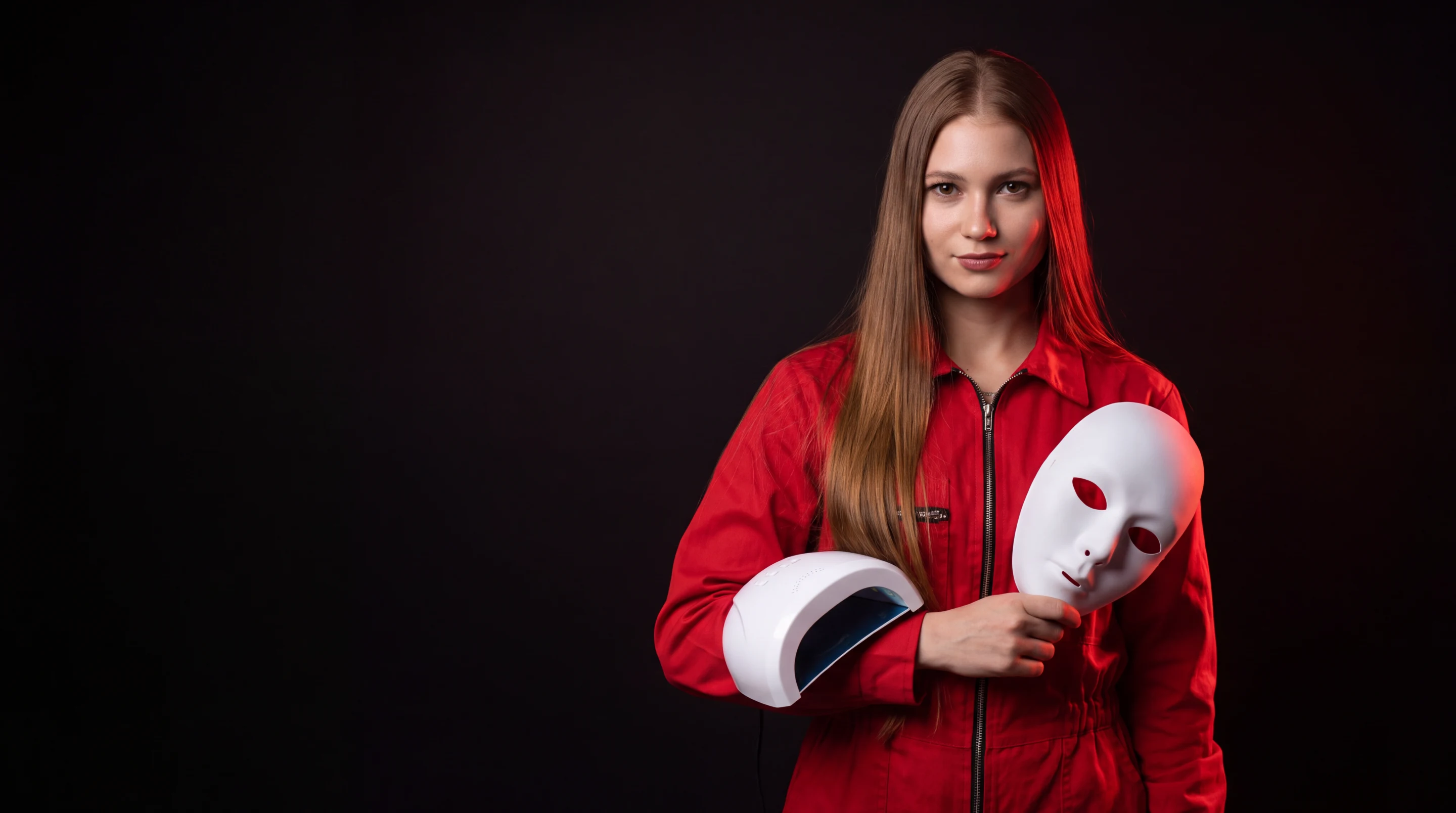 Karina w czerwonym kombinezonie z lampą UV do hybryd